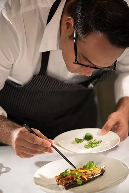Chef plating a fine dining dish