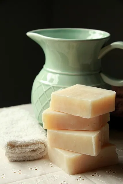 Stacked bars of handmade Rosella soap on linen