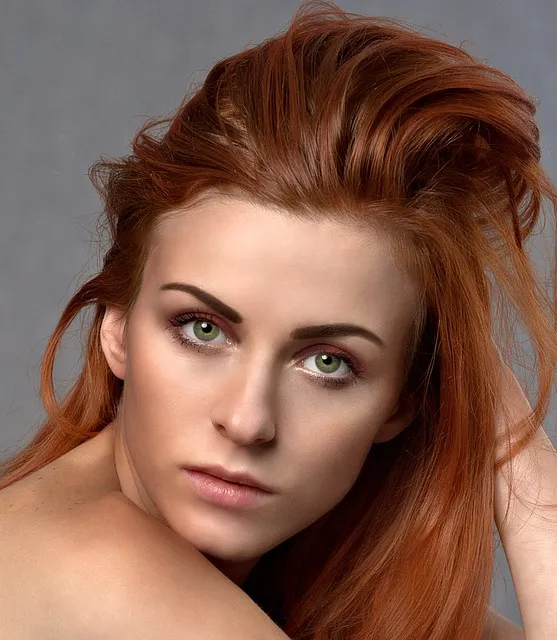 Woman with glowing skin applying makeup