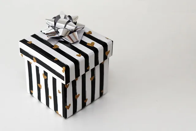 Minimal gift packaging design with bold monochrome stripes